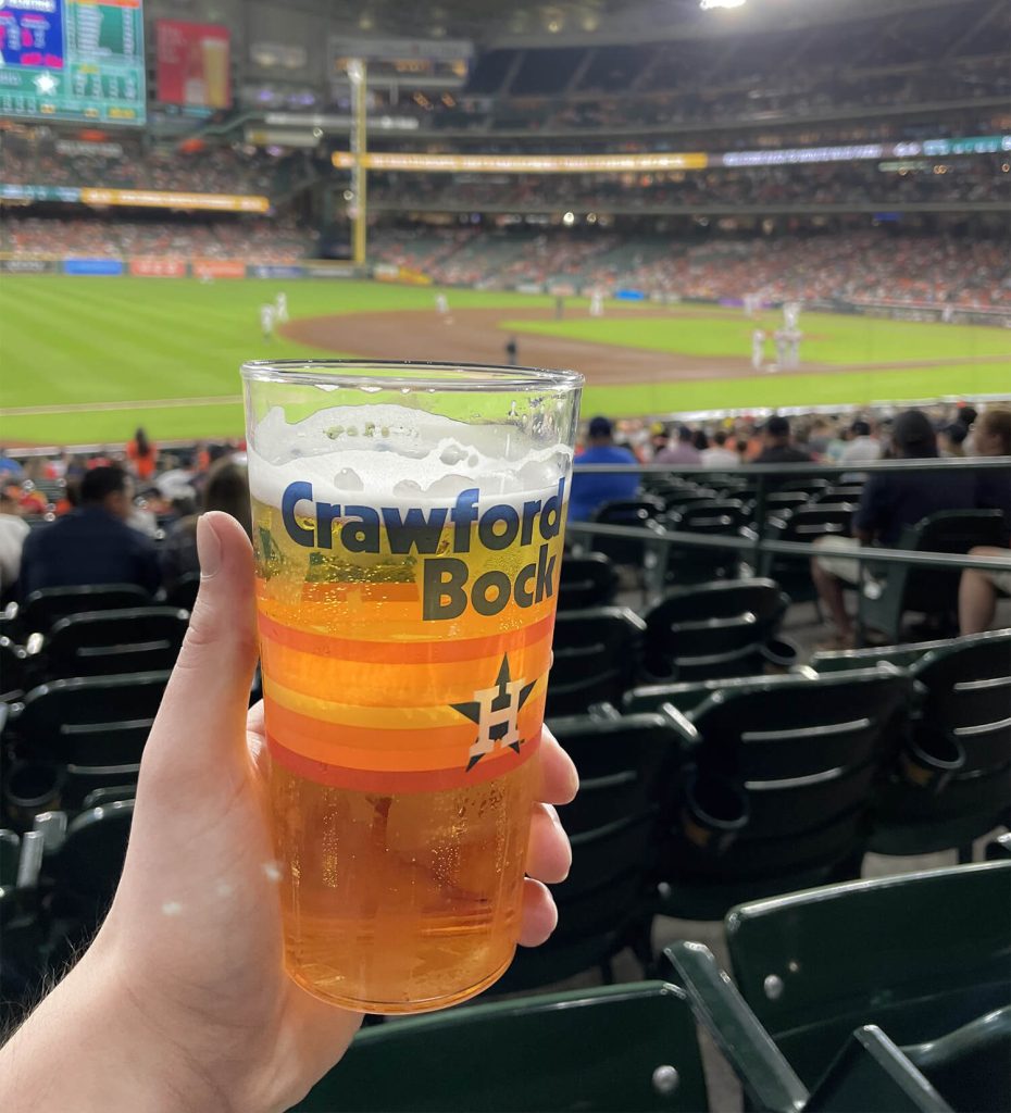 Branded promotional cup at a baseball game.